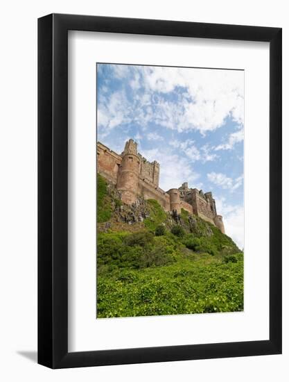 Bamburgh Castle, a hilltop fortress constructed on top of a craggy outcrop of volcanic dolerite-Stuart Forster-Framed Photographic Print