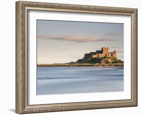 Bamburgh Castle Bathed in Golden Evening Light Overlooking Bamburgh Bay with the Sea Filling the Fo-Lee Frost-Framed Photographic Print