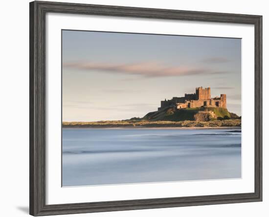 Bamburgh Castle Bathed in Golden Evening Light Overlooking Bamburgh Bay with the Sea Filling the Fo-Lee Frost-Framed Photographic Print