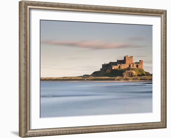 Bamburgh Castle Bathed in Golden Evening Light Overlooking Bamburgh Bay with the Sea Filling the Fo-Lee Frost-Framed Photographic Print