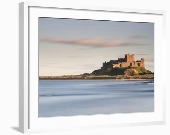 Bamburgh Castle Bathed in Golden Evening Light Overlooking Bamburgh Bay with the Sea Filling the Fo-Lee Frost-Framed Photographic Print