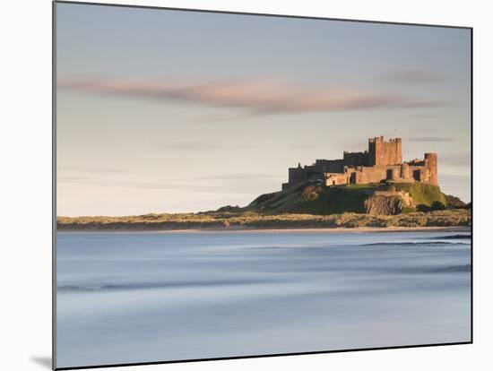 Bamburgh Castle Bathed in Golden Evening Light Overlooking Bamburgh Bay with the Sea Filling the Fo-Lee Frost-Mounted Photographic Print