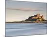 Bamburgh Castle Bathed in Golden Evening Light Overlooking Bamburgh Bay with the Sea Filling the Fo-Lee Frost-Mounted Photographic Print