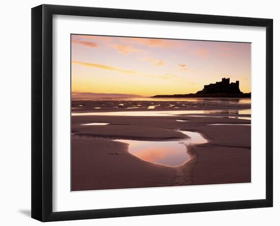 Bamburgh Castle in Silhouette at Sunrise, with Rock Pools on Empty Beach, Northumberland, England-Lee Frost-Framed Photographic Print