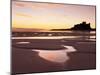 Bamburgh Castle in Silhouette at Sunrise, with Rock Pools on Empty Beach, Northumberland, England-Lee Frost-Mounted Photographic Print