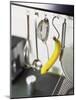 Banana and Kitchen Tools Hanging on Hooks in Kitchen-Kröger & Gross-Mounted Photographic Print