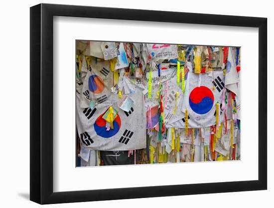 Barbed wire fence separates South from North Korea - South Korean flags and prayer wishes attach...-null-Framed Photographic Print