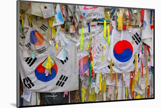 Barbed wire fence separates South from North Korea - South Korean flags and prayer wishes attach...-null-Mounted Photographic Print