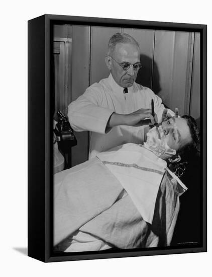 Barber Victor E. Aceto Shaving Passenger Aboard the 20th Century Limited-Alfred Eisenstaedt-Framed Premier Image Canvas