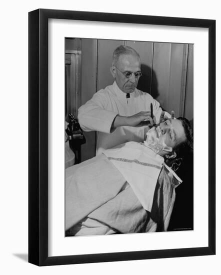 Barber Victor E. Aceto Shaving Passenger Aboard the 20th Century Limited-Alfred Eisenstaedt-Framed Photographic Print