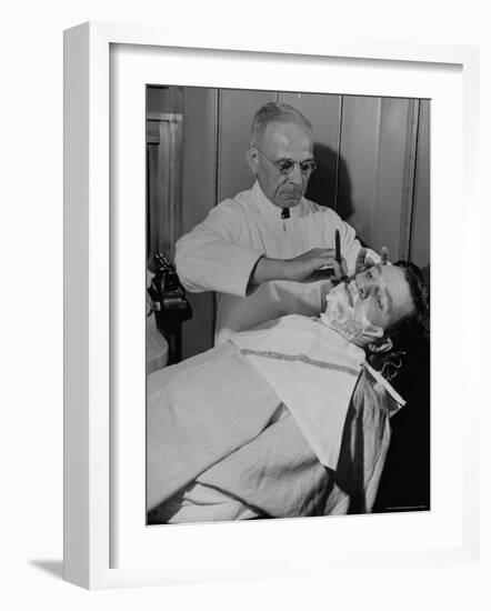 Barber Victor E. Aceto Shaving Passenger Aboard the 20th Century Limited-Alfred Eisenstaedt-Framed Photographic Print