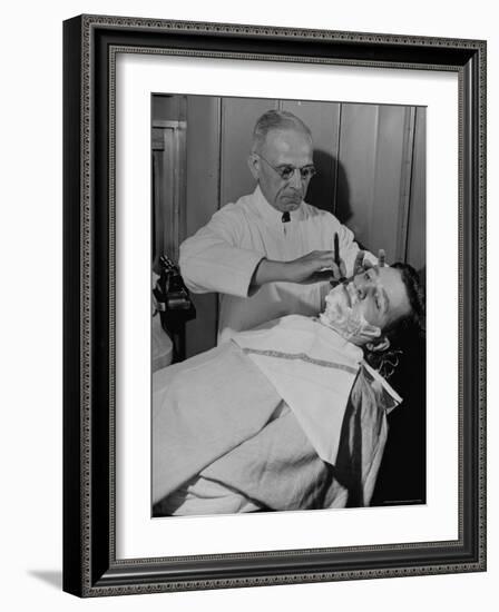 Barber Victor E. Aceto Shaving Passenger Aboard the 20th Century Limited-Alfred Eisenstaedt-Framed Photographic Print