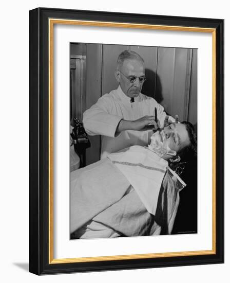 Barber Victor E. Aceto Shaving Passenger Aboard the 20th Century Limited-Alfred Eisenstaedt-Framed Photographic Print