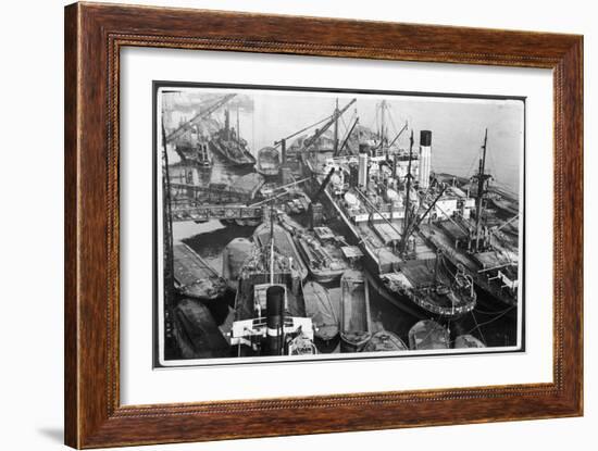 Barges Cranes and Tramp Steamers at the London Docks-null-Framed Art Print