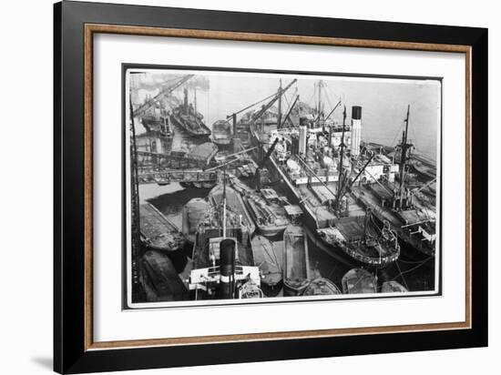 Barges Cranes and Tramp Steamers at the London Docks-null-Framed Art Print