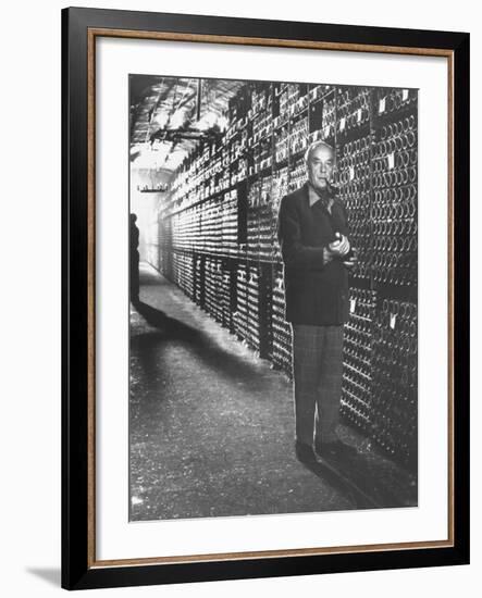 Baron Philippe De Rothschild in a Wine Cellar at Chateau Mouton Rothschild-Carlo Bavagnoli-Framed Photographic Print