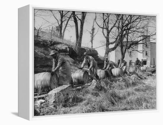 Barrels Being Rolled on Wooden Rails at Jack Daniels Distillery-Ed Clark-Framed Premier Image Canvas