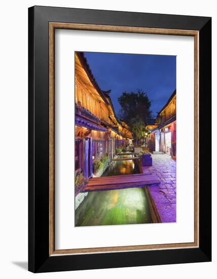 Bars and restaurants along canal at dusk, Lijiang, UNESCO World Heritage Site, Yunnan, China, Asia-Ian Trower-Framed Photographic Print