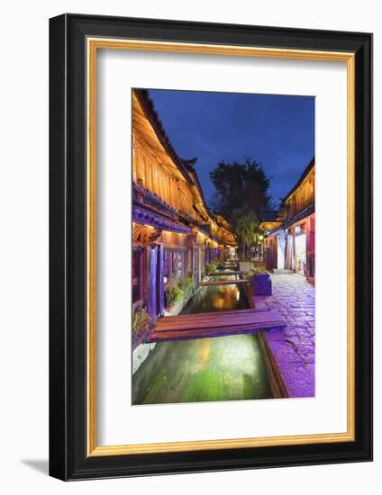 Bars and restaurants along canal at dusk, Lijiang, UNESCO World Heritage Site, Yunnan, China, Asia-Ian Trower-Framed Photographic Print