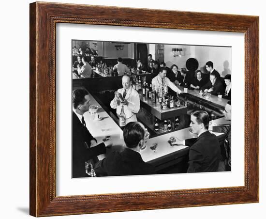 Bartender Prepares a Drink as Patrons Enjoy Themselves at Popular Speakeasy during Prohibition-Margaret Bourke-White-Framed Photographic Print