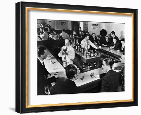 Bartender Prepares a Drink as Patrons Enjoy Themselves at Popular Speakeasy during Prohibition-Margaret Bourke-White-Framed Photographic Print