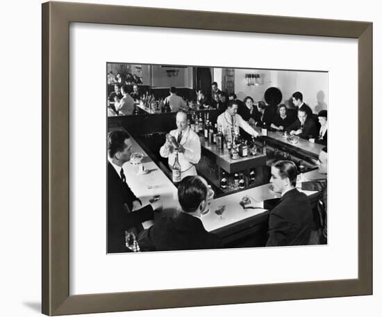 Bartender Prepares a Drink as Patrons Enjoy Themselves at Popular Speakeasy during Prohibition-Margaret Bourke-White-Framed Photographic Print