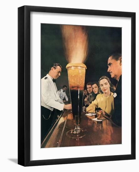 Bartender Tending Bar in the Zebra Room of the Town House, Los Angeles, California, 1946-Walter Sanders-Framed Photographic Print