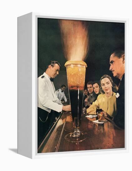 Bartender Tending Bar in the Zebra Room of the Town House, Los Angeles, California, 1946-Walter Sanders-Framed Premier Image Canvas