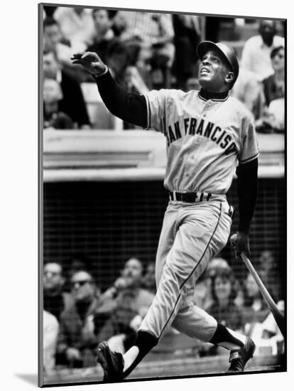 Baseball Player Willie Mays Watching Ball Clear Fence for Home Run in Game with Dodgers-Ralph Morse-Mounted Premium Photographic Print