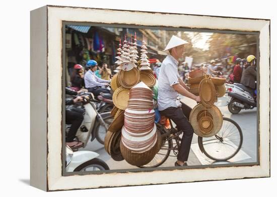 Basket and Hat Seller on Bicycle, Hanoi, Vietnam-Peter Adams-Framed Premier Image Canvas