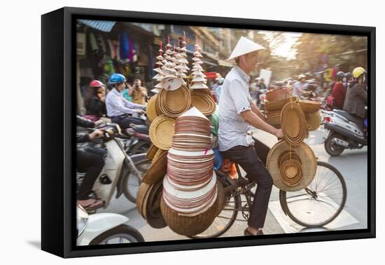 Basket and Hat Seller on Bicycle, Hanoi, Vietnam-Peter Adams-Framed Premier Image Canvas