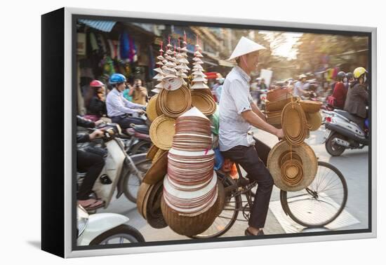 Basket and Hat Seller on Bicycle, Hanoi, Vietnam-Peter Adams-Framed Premier Image Canvas