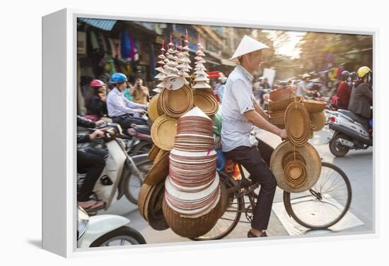 Basket and Hat Seller on Bicycle, Hanoi, Vietnam-Peter Adams-Framed Premier Image Canvas