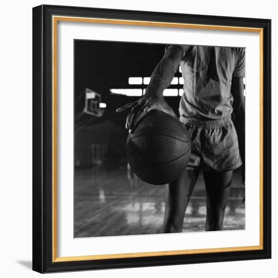 Basketball Held by Player Wilt Chamberlain, 1956-Frank Scherschel-Framed Premium Photographic Print