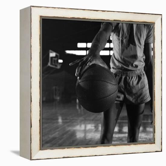 Basketball Held by Player Wilt Chamberlain, 1956-Frank Scherschel-Framed Premier Image Canvas