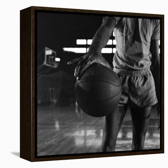 Basketball Held by Player Wilt Chamberlain, 1956-Frank Scherschel-Framed Premier Image Canvas