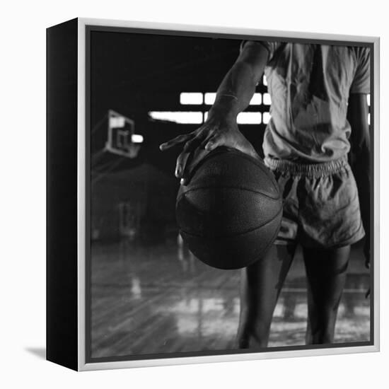 Basketball Held by Player Wilt Chamberlain, 1956-Frank Scherschel-Framed Premier Image Canvas