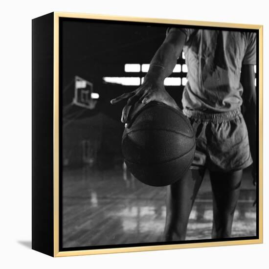 Basketball Held by Player Wilt Chamberlain, 1956-Frank Scherschel-Framed Premier Image Canvas