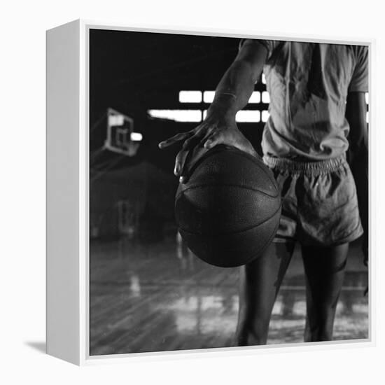 Basketball Held by Player Wilt Chamberlain, 1956-Frank Scherschel-Framed Premier Image Canvas