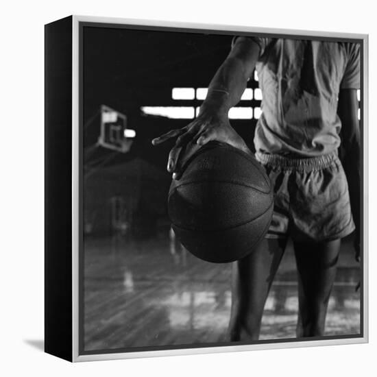 Basketball Held by Player Wilt Chamberlain, 1956-Frank Scherschel-Framed Premier Image Canvas