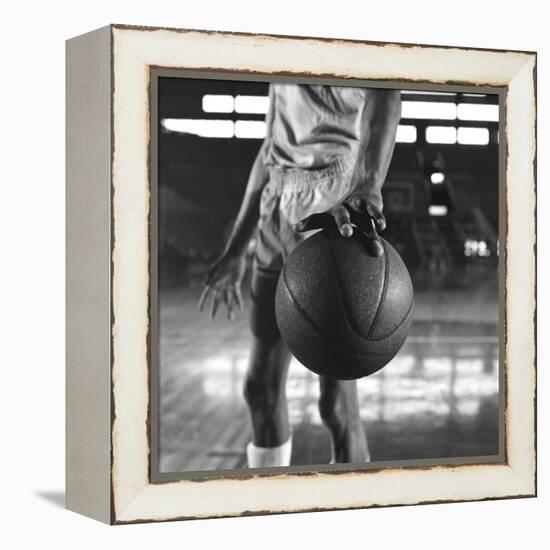 Basketball Held by Player Wilt Chamberlain, 1956-Frank Scherschel-Framed Premier Image Canvas