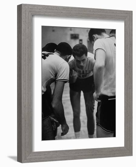 Basketball Player Tom Gola in a Huddle During a Basketball Game-null-Framed Photographic Print