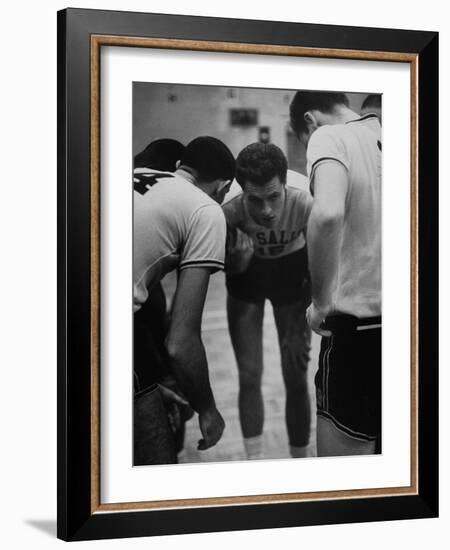 Basketball Player Tom Gola in a Huddle During a Basketball Game-null-Framed Photographic Print