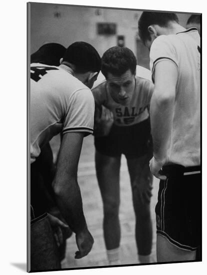 Basketball Player Tom Gola in a Huddle During a Basketball Game-null-Mounted Photographic Print