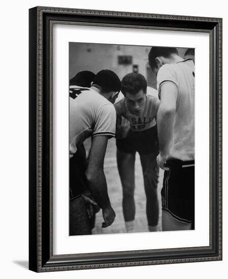 Basketball Player Tom Gola in a Huddle During a Basketball Game-null-Framed Photographic Print