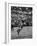 Basketball Player Tom Gola Leaping in the Air to Make a Shot During a Basketball Game-null-Framed Photographic Print