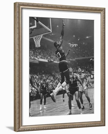 Basketball Player Wilt Chamberlain During Game Against the Celtics-George Silk-Framed Premium Photographic Print