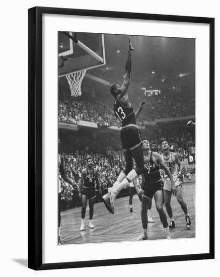 Basketball Player Wilt Chamberlain During Game Against the Celtics-George Silk-Framed Premium Photographic Print