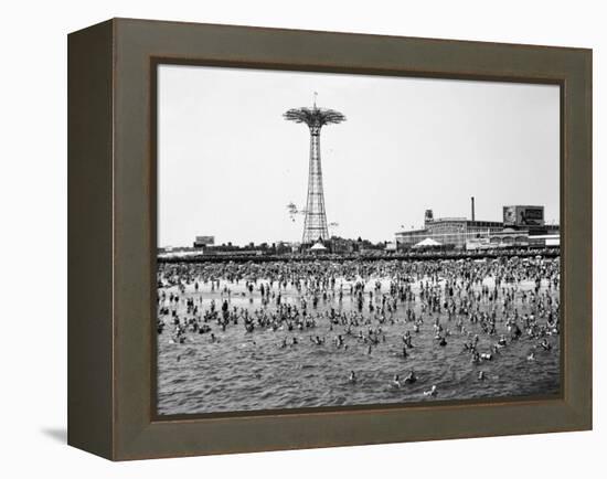 Bathers Enjoying Coney Island Beaches. Parachute Ride and Steeplechase Park Visible in the Rear-Margaret Bourke-White-Framed Premier Image Canvas