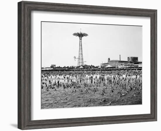 Bathers Enjoying Coney Island Beaches. Parachute Ride and Steeplechase Park Visible in the Rear-Margaret Bourke-White-Framed Photographic Print